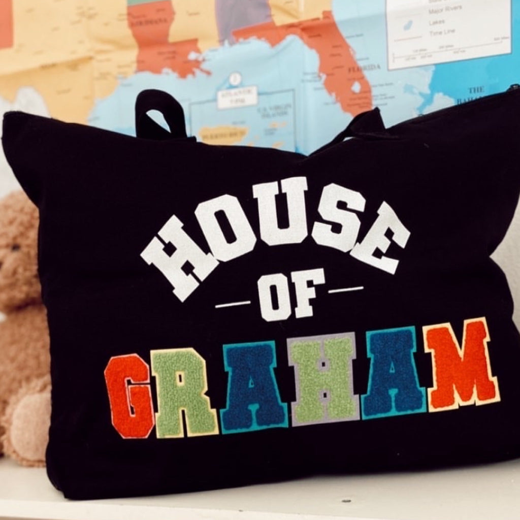 black canvas tote back with custom multi color chenille patches to personalize the tote bag with your name or funny saying