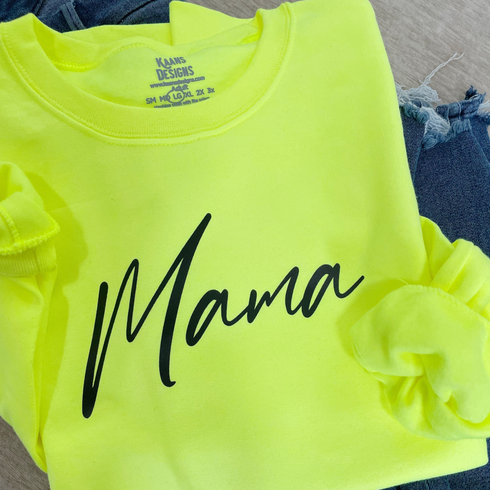 close up of womens pullover sweatshirt with screen print design that says mama the color is a highlighter green cozy and cute casual sweatshirt