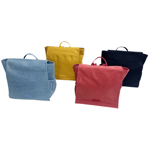 four bags displayed behind a white back ground showing multipl color options, blue jean, coral, black, and butterscotch