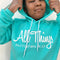 teen wearing inspring hoodie in teal color that is referencing scripture in the bible Philippians 4:13 I can do all things through christ who strengthens me.