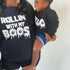 mom and toddler daughter wearing halloween sweatshirts matching and smiling in screen print designs rollin with my boos